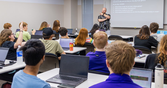 Students seated in classroom interacting with instructor