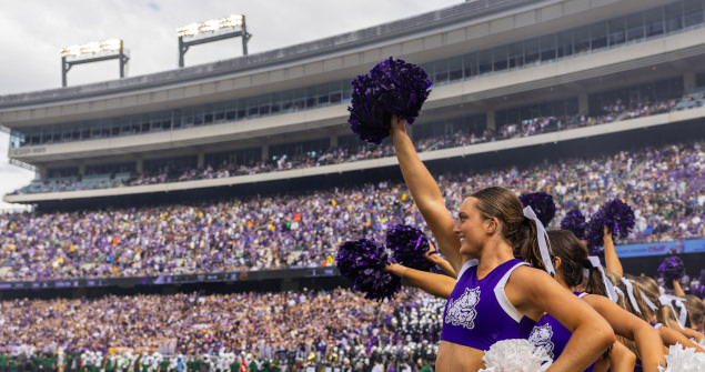 TCU cheerleaders cheer on the Frogs during a football game