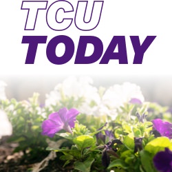 TCU Today with some flowers in the foreground